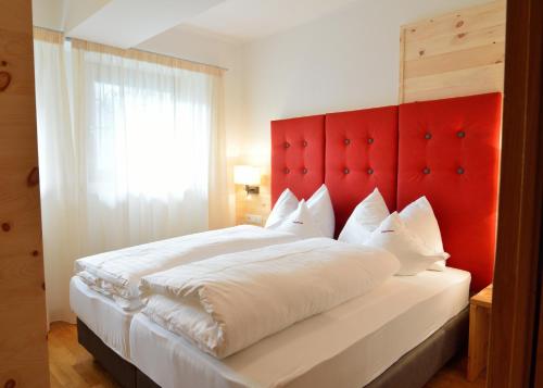 Postel nebo postele na pokoji v ubytování Residence Magdalena
