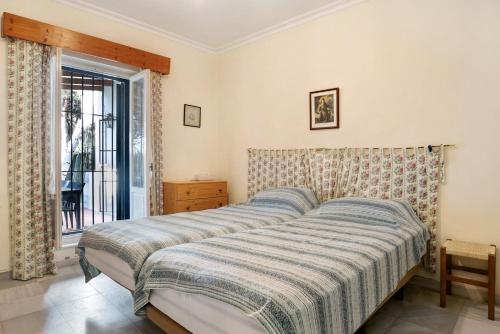 Un pat sau paturi într-o cameră la El Mirlito