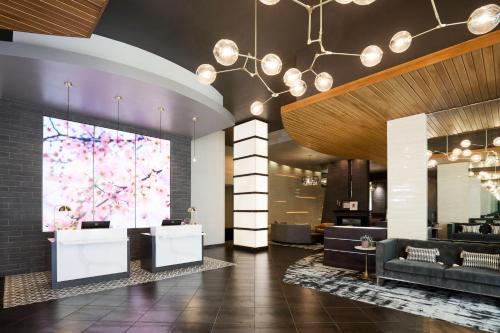 a lobby of a hotel with a large window at Archer Hotel Falls Church in Fairfax