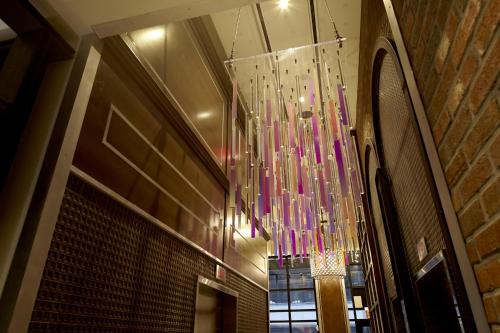 a chandelier hanging from the ceiling in a building at Archer Hotel New York in New York