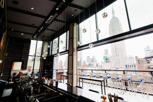 a view from a window of a building with many windows at Archer Hotel New York in New York