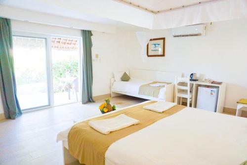 Katil atau katil-katil dalam bilik di Dhow Inn Boutique Hotel