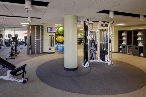 a gym with a column and some exercise equipment at Archer Hotel Napa in Napa