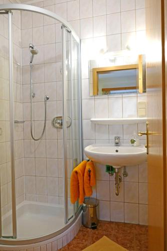 a bathroom with a shower and a sink at Hiaslahof in Mariapfarr