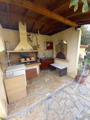 an outdoor kitchen with a stove and an oven at Phaedra Electra Estate 