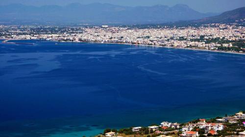 an aerial view of a city and a large body of water at Phaedra Electra Estate in Tsoukalaíika