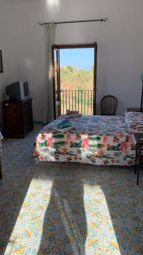 Ένα ή περισσότερα κρεβάτια σε δωμάτιο στο Residence Salvatore
