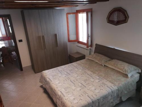 Ліжко або ліжка в номері Pellestrina Vacanze