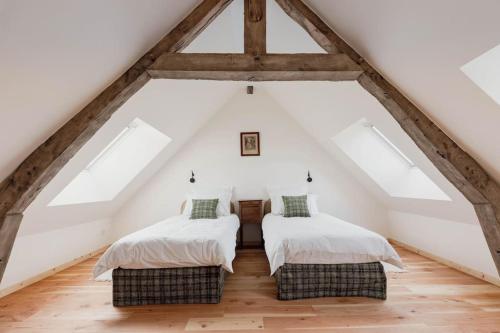 Postel nebo postele na pokoji v ubytování Gîte de la Garenne - Cottage chaleureux avec piscine