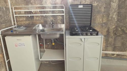 a small kitchen with a sink and a stove at VERTICAL CLIMBING MALTA in Qrendi