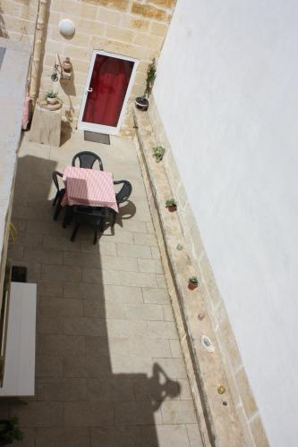 an overhead view of a table and chairs on a patio at VERTICAL CLIMBING MALTA in Qrendi