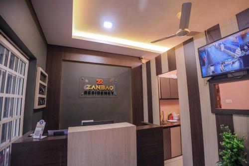 a lobby with a gaming machine sign on the wall at zanbaq residency in Vythiri