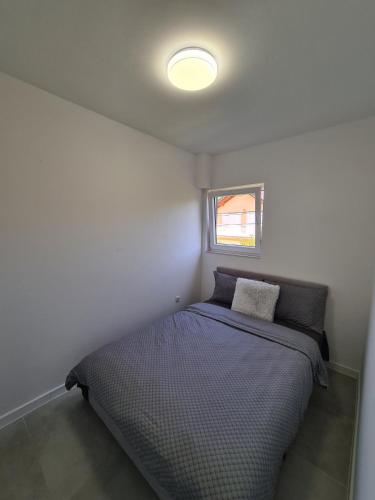 Postel nebo postele na pokoji v ubytování Apartmani Bugojno