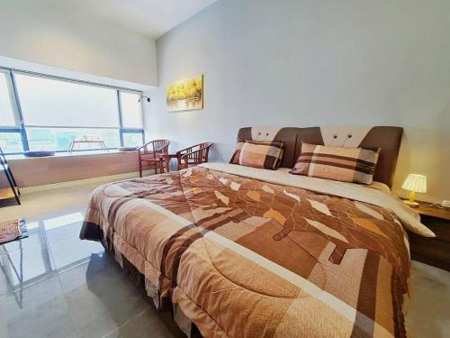 a bedroom with a large bed and a large window at SeaView#Warmth#Netflix#PrivateBathtub#SeaSideLuxuryCondo#ImperioResidence in Melaka