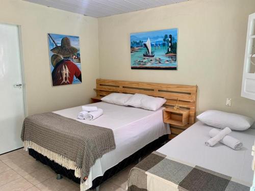 A bed or beds in a room at Pousada Verdes Mares Porto De Galinhas