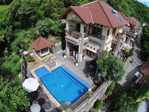 an aerial view of a house with a swimming pool at Puri Pondok Dawa Villa in Kusamba