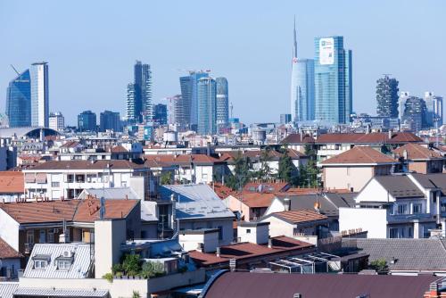 a view of a city with tall buildings at Ramada Plaza Milano in Milan