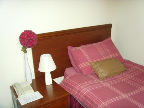 Ένα ή περισσότερα κρεβάτια σε δωμάτιο στο The Waverley Hotel