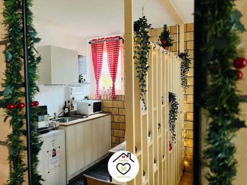 a kitchen with christmas garland on the walls at Family M Apartments 1 in Kappel bei Olten