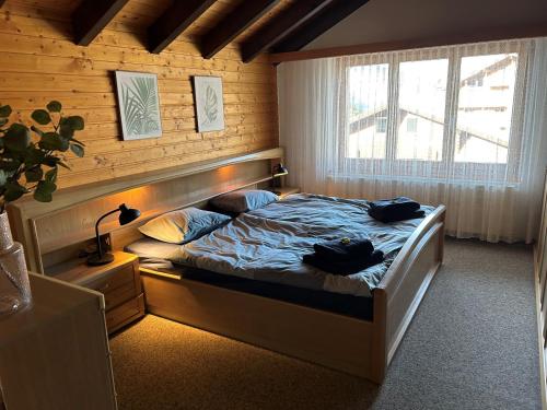 Postel nebo postele na pokoji v ubytování AtlantisINN Bärgli