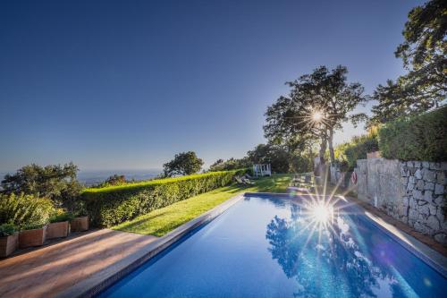 a swimming pool in the backyard of a house at VilaFoia in Monchique