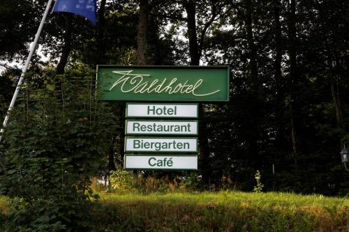 a sign for a hotel restaurantrigerator cafe at Waldhotel Wilhelmshöhe in Freudenberg
