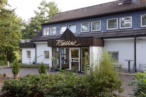 a building with a sign that reads turled at Waldhotel Wilhelmshöhe in Freudenberg