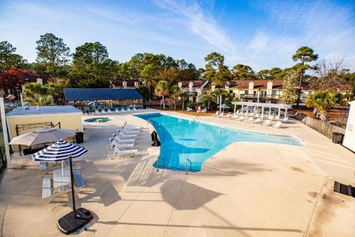 a large swimming pool with chairs at The Links in Myrtle Beach