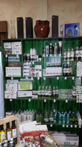 a store shelf filled with lots of different items at Hotel Rural El Arriero in La Zarza