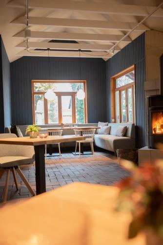 a living room with a couch and a table at Das Anni's in Wangerland