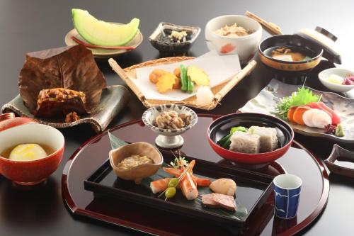 a table topped with different types of food at Ichinoyu Katei in Yamanouchi