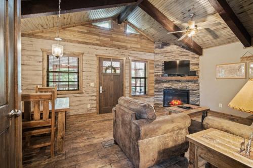 a living room with a couch and a fireplace at Table Rock Resorts at Indian Point in Branson