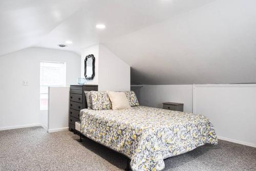 a bedroom with a bed and a dresser at Beautiful Pittsburgh home-walkable area w parking in Pittsburgh