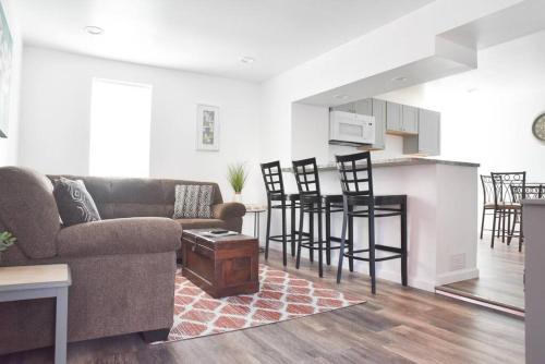 a living room with a couch and a kitchen at Perfect Mount Washington Home Walkable w Parking in Pittsburgh
