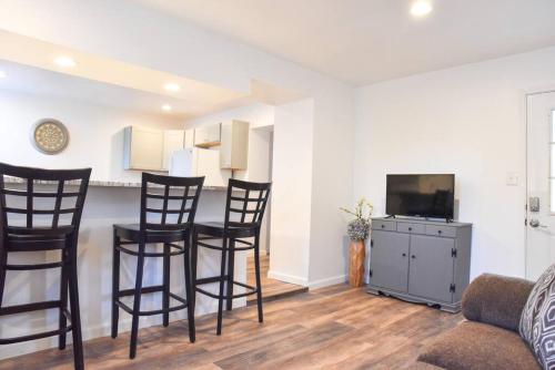 a living room with chairs and a table and a tv at Perfect Mount Washington Home Walkable w Parking in Pittsburgh