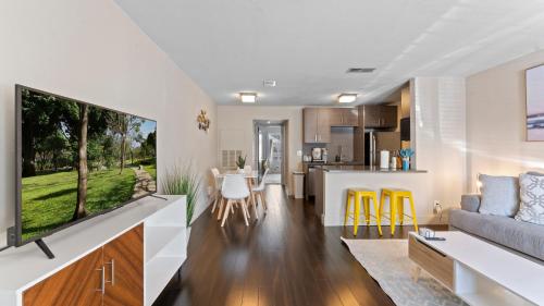 a living room and kitchen with a couch and a table at Extended Stay Apartments Next to Downtown in Austin