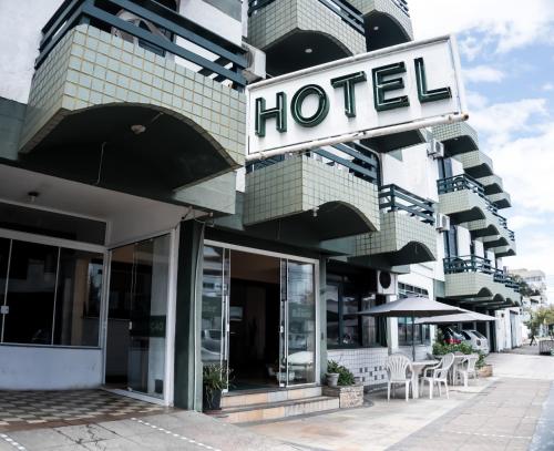 a hotel with a sign on the front of it at Hotel Bauer in Torres