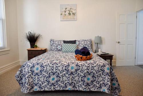 a bedroom with a bed with a basket on it at Perfect Pittsburgh Home Close To City & Airport in Pittsburgh
