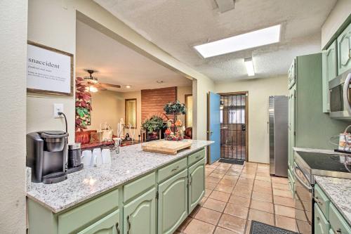 a kitchen with green cabinets and a counter top at Rio Rancho Home Less Than 14 Mi Old Town Albuquerque! in Rio Rancho