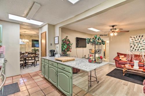 a kitchen and living room with a couch and a table at Rio Rancho Home Less Than 14 Mi Old Town Albuquerque! in Rio Rancho