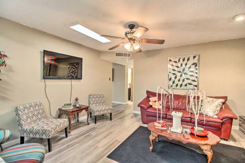 a living room with a red couch and chairs at Rio Rancho Home Less Than 14 Mi Old Town Albuquerque! in Rio Rancho