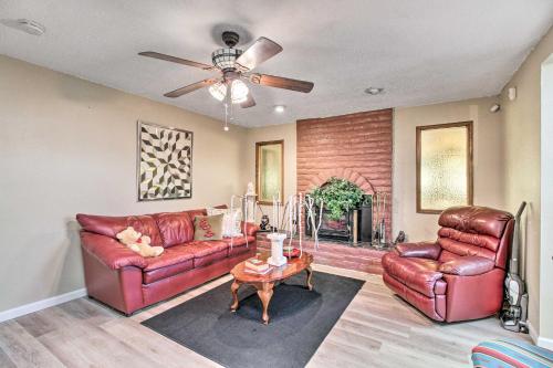 a living room with leather furniture and a ceiling fan at Rio Rancho Home Less Than 14 Mi Old Town Albuquerque! in Rio Rancho