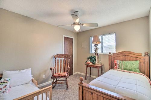 a bedroom with a bed and a ceiling fan at Rio Rancho Home Less Than 14 Mi Old Town Albuquerque! in Rio Rancho