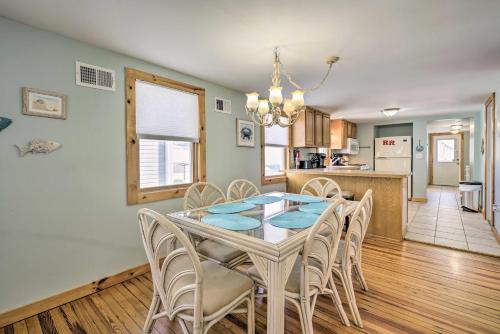 a dining room with a table and chairs and a kitchen at Jersey Apt - half Mi to Seaside Heights Beach in Seaside Heights