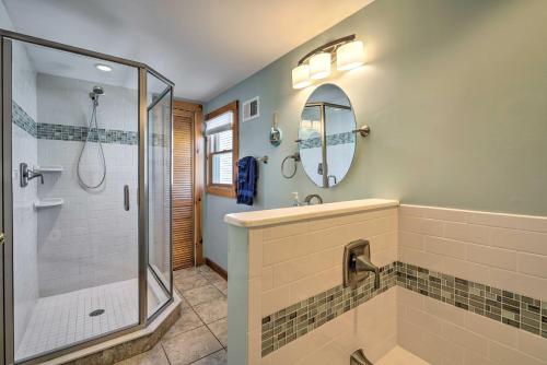 a bathroom with a shower and a sink and a mirror at Jersey Apt - half Mi to Seaside Heights Beach in Seaside Heights