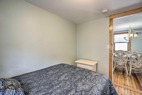a bedroom with a bed and a table and a window at Jersey Apt - half Mi to Seaside Heights Beach in Seaside Heights