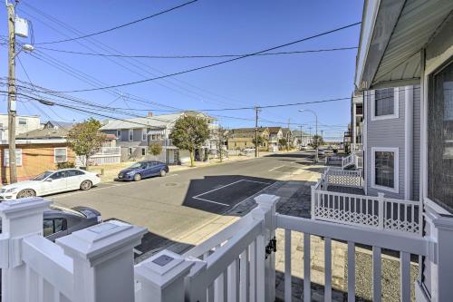 a white fence in front of a house with a street at Jersey Apt - half Mi to Seaside Heights Beach in Seaside Heights