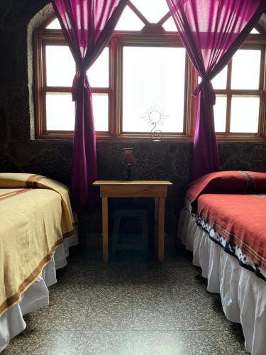 Katil atau katil-katil dalam bilik di Casa Qatzij - Guest House, Lake Atitlan