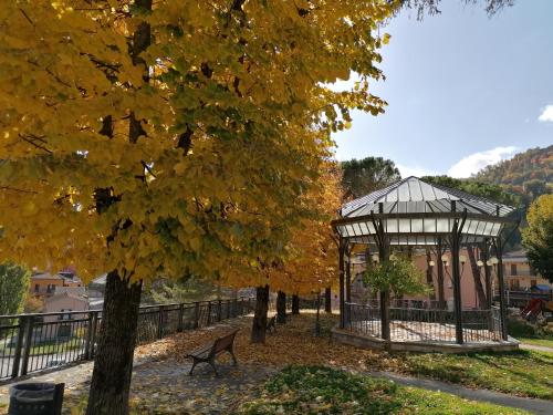 a gazebo and a bench in a park at Hotel Centrale in Cascia