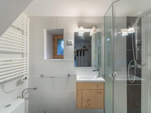 a bathroom with a sink and a glass shower at Maison Méribel, 3 pièces, 6 personnes - FR-1-566-21 in Les Allues